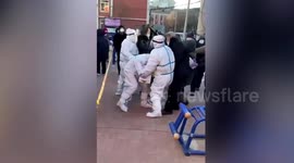 Father and son jailed after beating up police officer as they queue for coronavirus tests in China