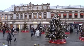 Designer Christmas trees line up Kuznetsky Most outside TSUM department store in Moscow