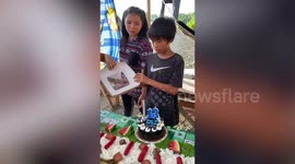 Boy Suprised By Birthday Cake Sparkler Candle