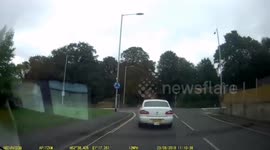 Moped Dangerously overtakes on a Roundabout Dash Cam UK