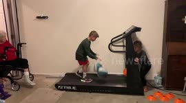 7 year old Zeke dribbling Basketballs on treadmill between Cones
