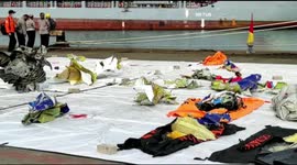 Debris from Indonesia plane crash laid out in Jakarta port