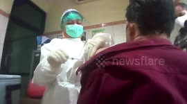 Healthcare workers in Indonesia run vaccination drill in preparation for inoculating population