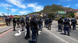 Cape Town residents clash with armed police over land evictions