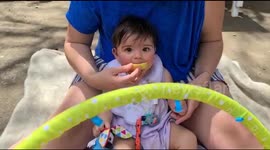 Cute baby eats lemon like a boss