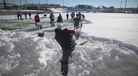 Football club near Madrid asks supporters to help clear snow from pitch