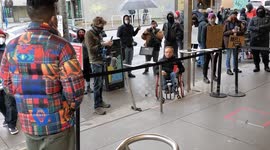 Customer interacts with protesters outside Powell's Books