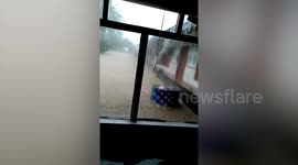 Flash floods gush through village in Indonesia