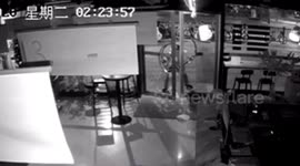 Chinese police catch robber sleeping in shop after he could not squeeze through gap in doors