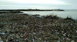 Garbage adorns the coast of Padang