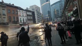 Demonstrators clash with police as death of young man in police custody sparks protests in Brussels