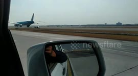 Crazed driver breaches security and drives into path of an oncoming PLANE