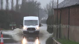 Vehicles struggle to pass through submerged roads as flooding strikes Derbyshire, UK