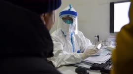 FILE: WHO scientists arrive in Wuhan to investigate origins of COVID-19