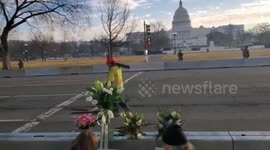 Mourners lay flowers for victims of DC insurrection