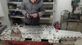 Chinese welder uses stainless steel to create aircraft carrier models in eastern China