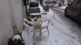 Icicles growing on garden furniture in old Moscow courtyard