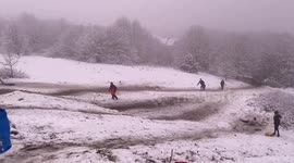 Sledgers enjoy snowy day in Sheffield park, UK