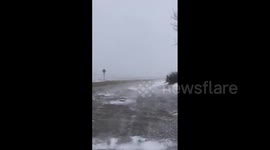 Blizzard conditions with heavy snowfall and gusty winds in Nebraska