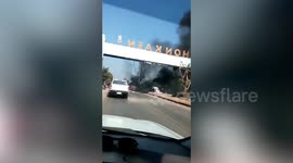 Bizarre moment giant dinosaur statue was engulfed in flames