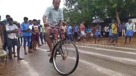 Indian villagers compete in bizarre event to see who can cycle SLOWEST