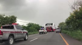 Truck Carries Catamaran Along Highway In Thailand