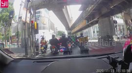 Heartwarming moment motorcycle rider helps old man cross busy Thai road