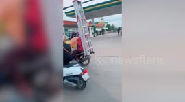 Adorable Dog Wears Helmet While Riding Motorbike With Owners