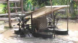 Solar powered machine used to keep water fresh on a pond in Thailand.