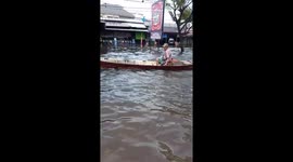 Man uses ship to sail through highways during floods in Indonesia