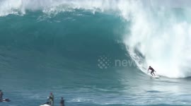 Watch surfers ride huge 40-foot waves in Hawaii