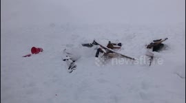 Avalanche at Russian ski resort prompts search efforts amid fears up to 12 people could be buried by snow