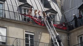 Femen Taken off Roof by Paris Firemen above Far Right Demo