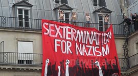 Femen Occupy Roof above Far Right Demo- Paris. Balcony shots