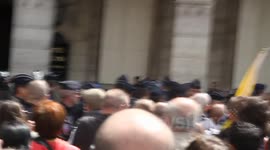 Topless Femen Activists Shielded from Far Right Demonstrators. Close shots. Brought down ladder, placed in police van
