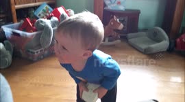 Toddler plays with a smoke detector