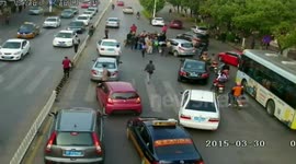 Cyclist rescued from under car in China