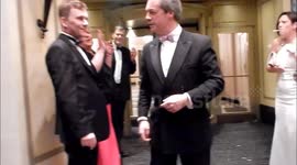 Nigel Farage leaves Mayfair party