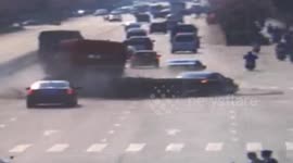 Moment truck crashes sideways across highway in China