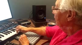 Man teaches grandma to play synthesizer
