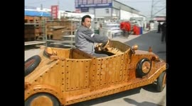 Carpenter drives classic car made out of pine wood