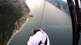 Watch this paraglider crash into Italy's iconic Lake Garda