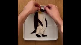 Watch as this food artist transforms fruit and veg into a penguin