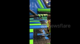 Miami toddler gets continuously knocked over by spinning inflatable