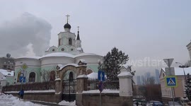 Moscow skyline - Temple of Exaltation of the Holy Cross with Moscow City skyscrapers in the background