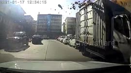 External wall insulation hits car after falling off building due to winds in northern China