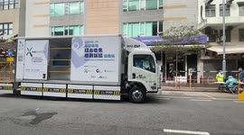 COVID-19 sample collect and mobile testing vans are parked outside the streets at Yau Tsim Mong area