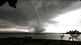 Seconds of a tornado is recorded by a resident's cellphone camera in the Gajah Mungkur reservoir area, Wonogiri, Central Java Indonesia