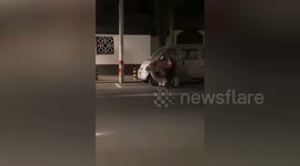 Elderly Chinese woman rides toy car back home from work