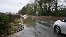 Watch as cars brave flooded roads in Lancashire as Storm Christoph causes chaos in northwest England